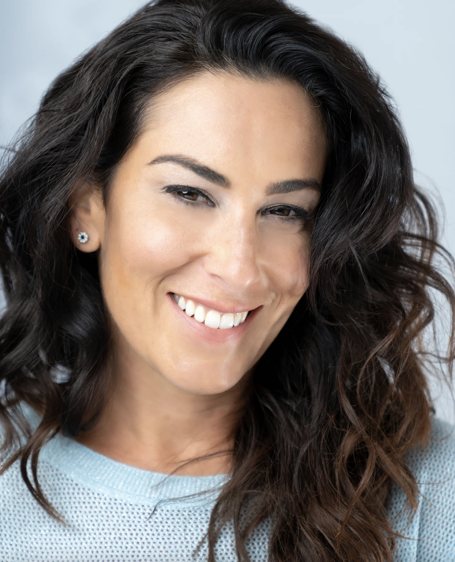 Jennifer Yosefa Fain wearing a light blue shirt and smiling